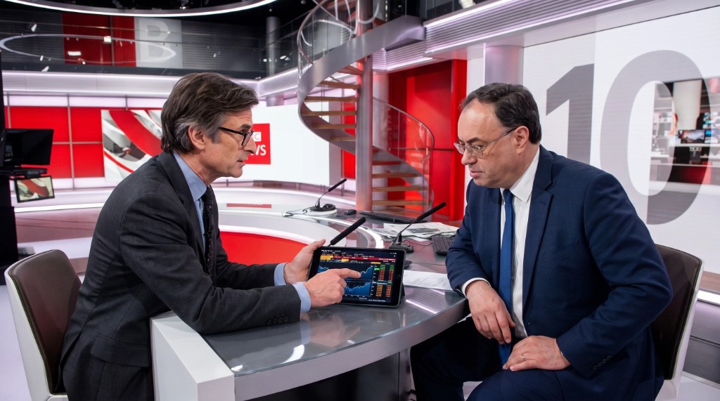 Robert Peston showing Andrew Bailey market figures on a tablet